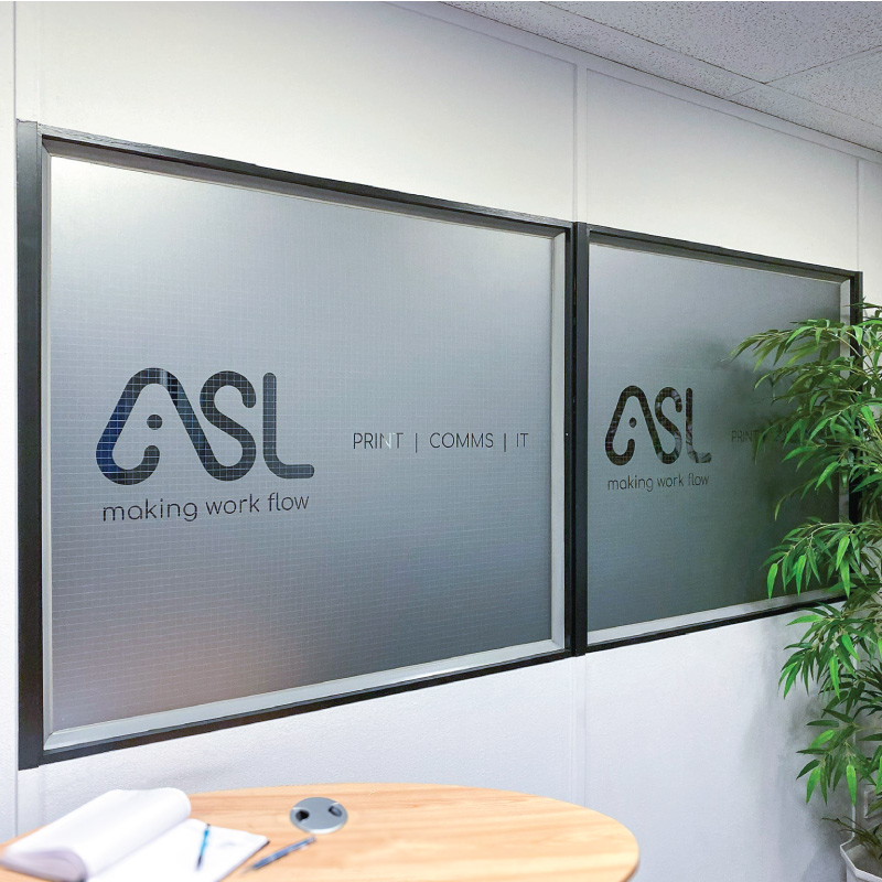 Two internal office windows covered in frosting with the ASL logo CAD cut from it.
